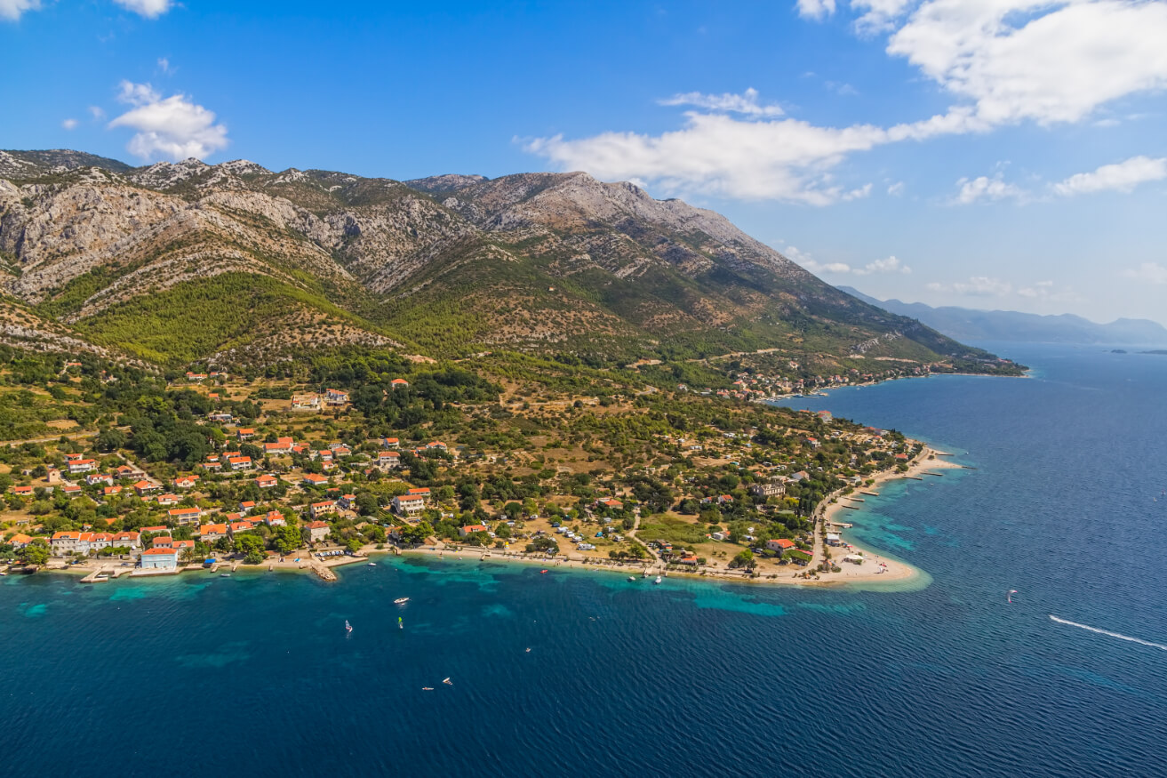 Helicopter aerial shoot of sandy beach Zrnovo near Orebic on Peljesac peninsula