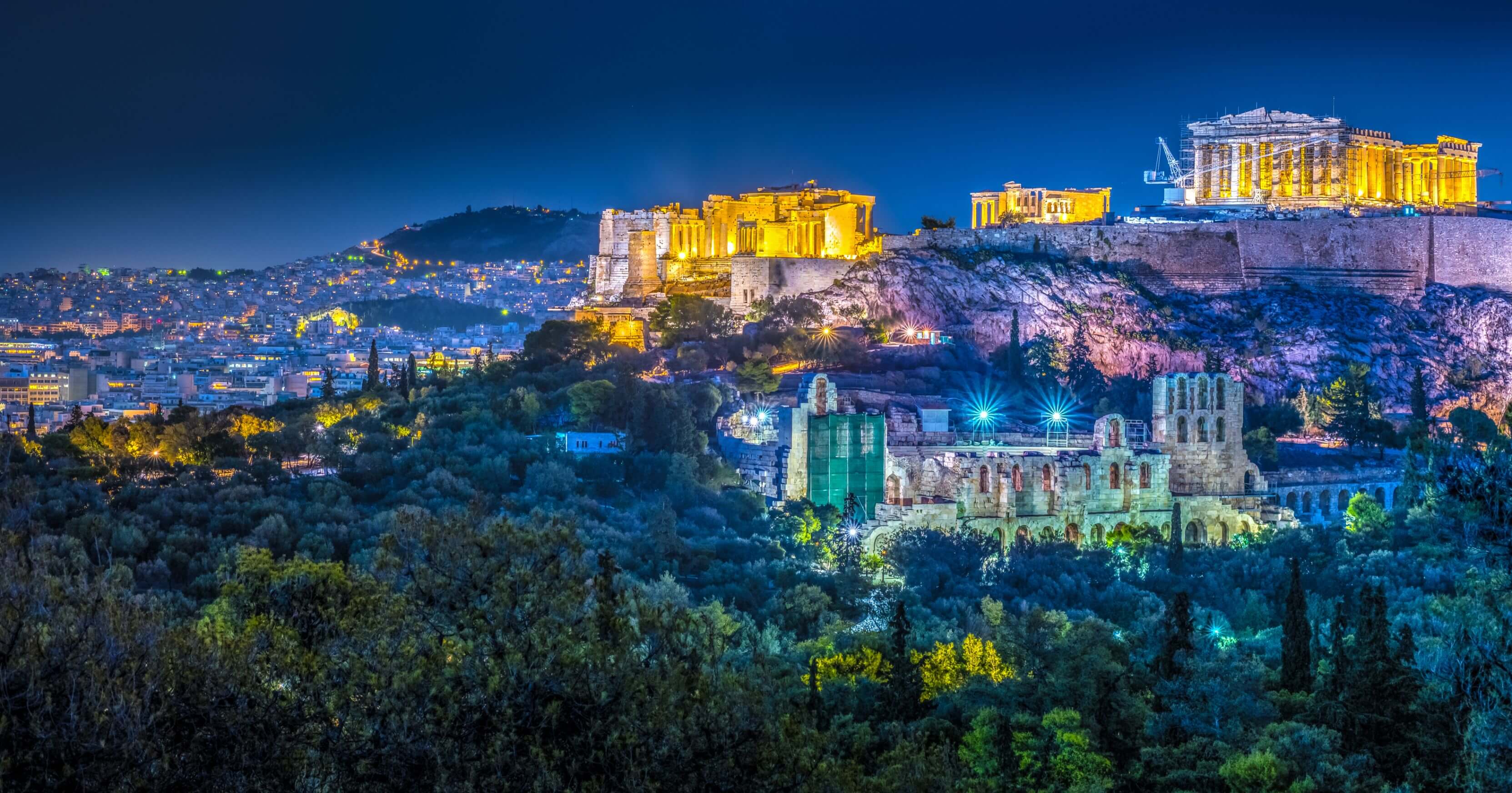 Parthenon and Herodium construction in Acropolis Hill in Athens, Greece shot in blue hou