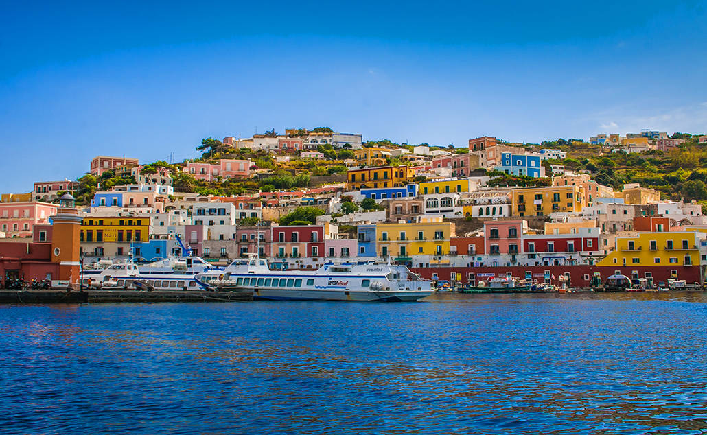 View-of-the-Main-Harbor-and-Port-at-Ponza-Italy.-Boats-at-sea-and-houses-on-the-mountainous-coastline