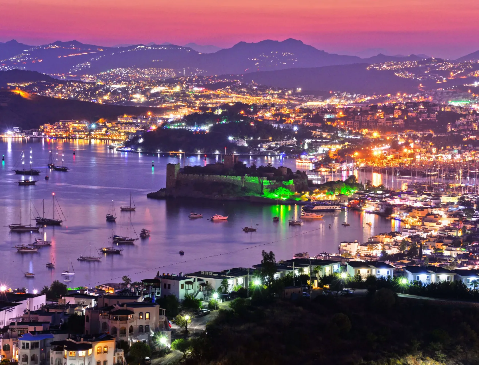 View of Bodrum harbor and Castle of St. Peter by night. Turkish Riviera