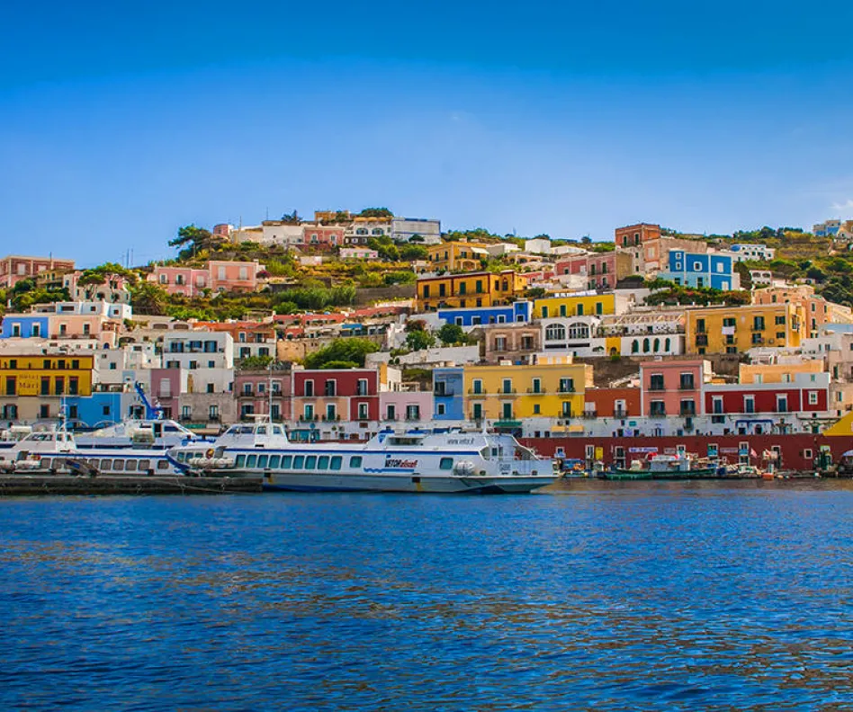 View-of-the-Main-Harbor-and-Port-at-Ponza-Italy.-Boats-at-sea-and-houses-on-the-mountainous-coastline