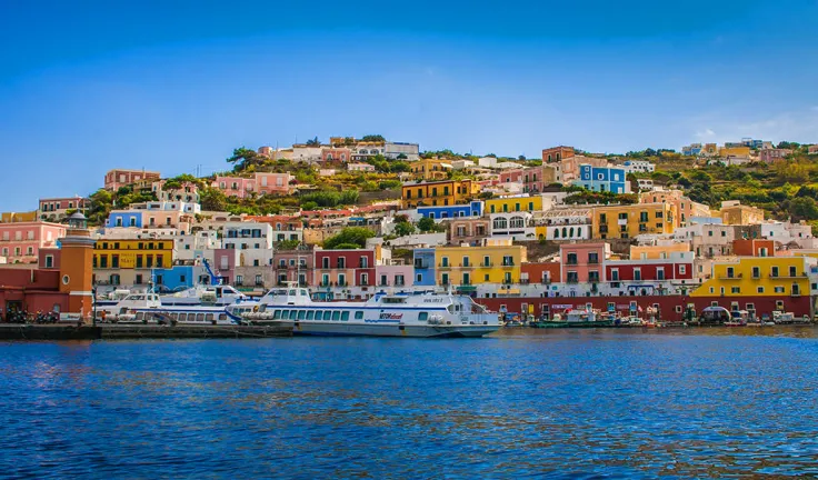 View-of-the-Main-Harbor-and-Port-at-Ponza-Italy.-Boats-at-sea-and-houses-on-the-mountainous-coastline