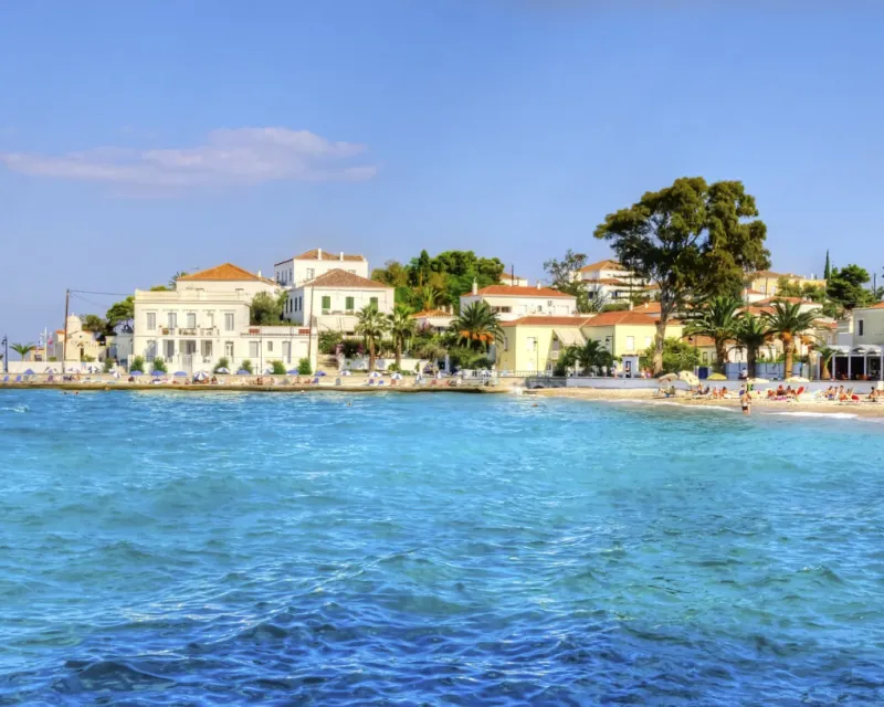 A view of the beach and some local architecture on the beautiful Greek Island Spetses