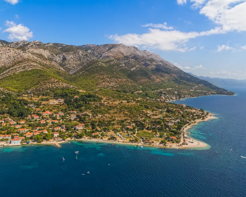 Helicopter aerial shoot of sandy beach Zrnovo near Orebic on Peljesac peninsula