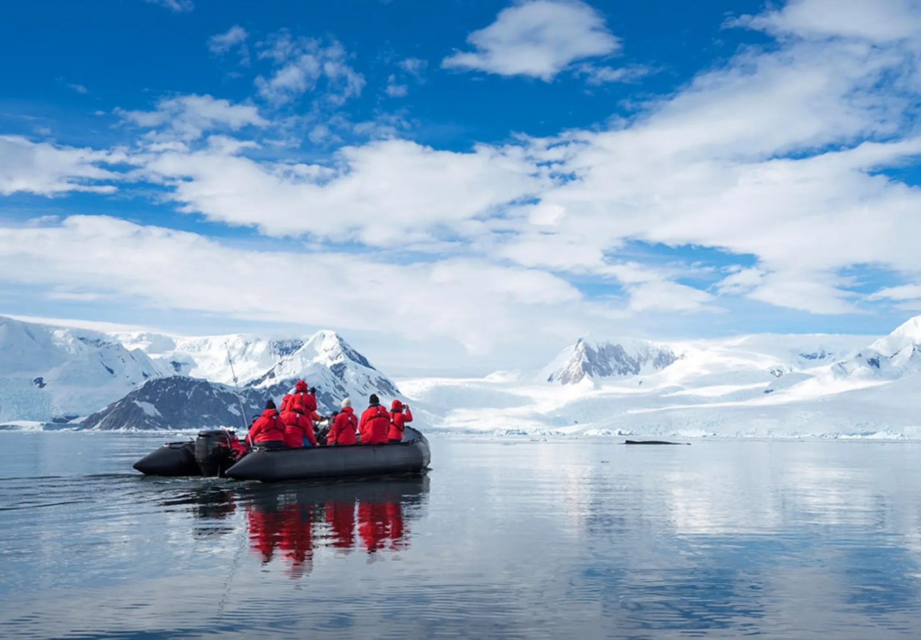 Inflatable-boat-full-of-tourists-watching-for-whales-and-seals-Antarctic-Peninsula-Antarctica