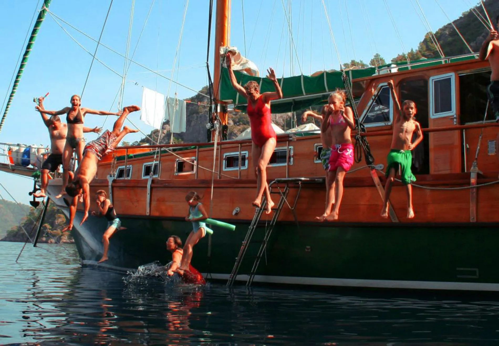 family-trip-jumping-into-sea